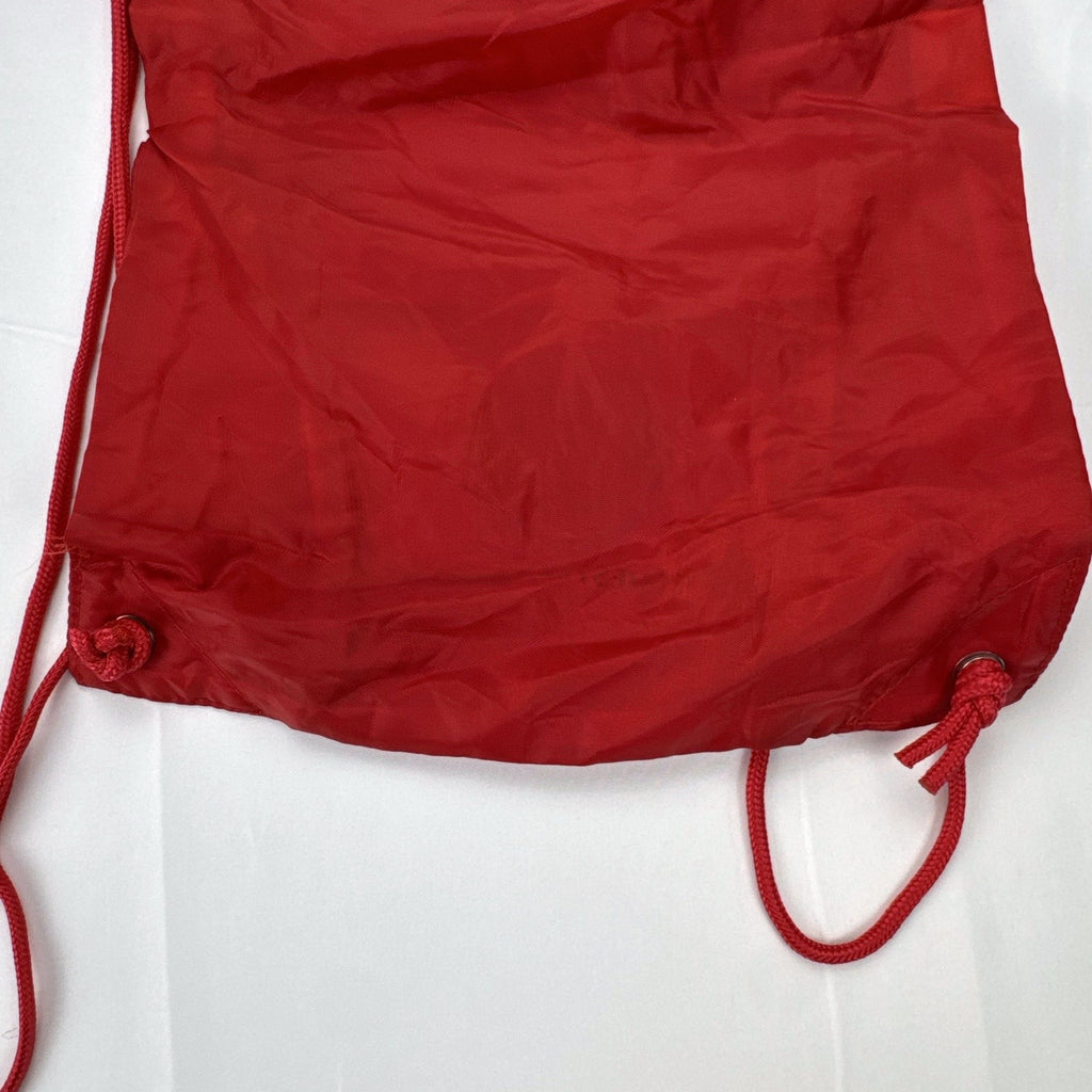 Manchester United FC red drawstring gym bag with embroidered crest and black trim