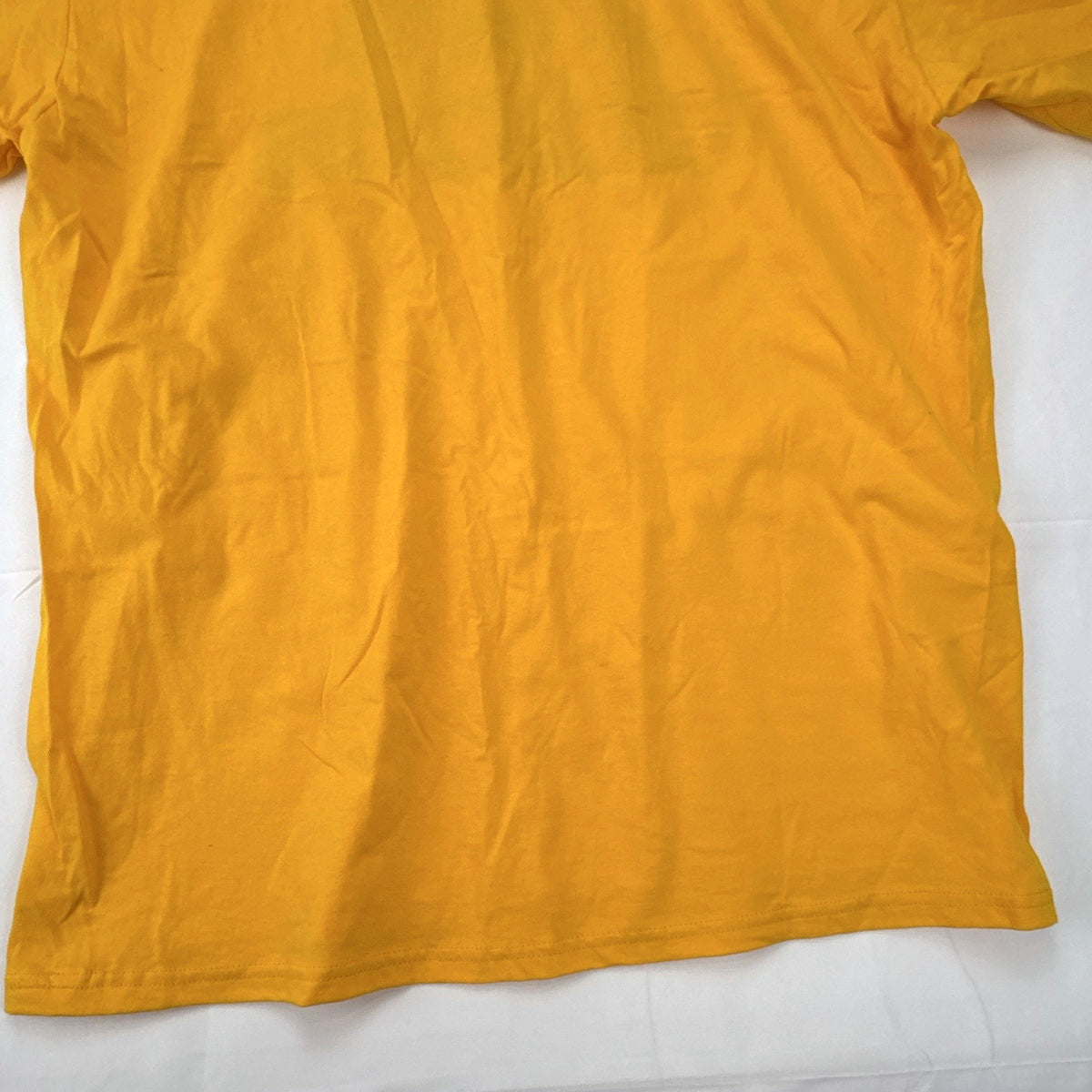 Front view of yellow adidas The Go-To graphic t-shirt in men's XL with black Badge of Sport logo