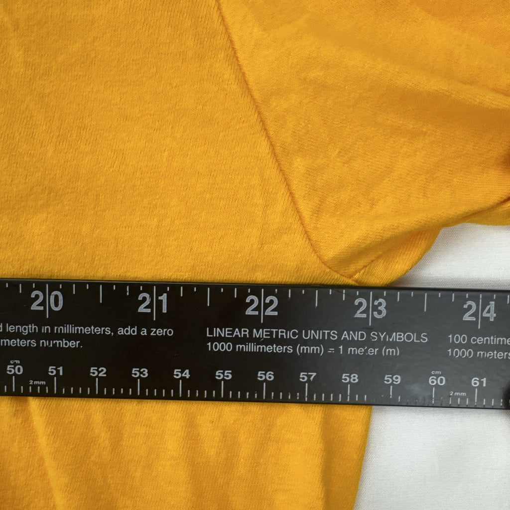 Front view of yellow adidas The Go-To graphic t-shirt in men's XL with black Badge of Sport logo