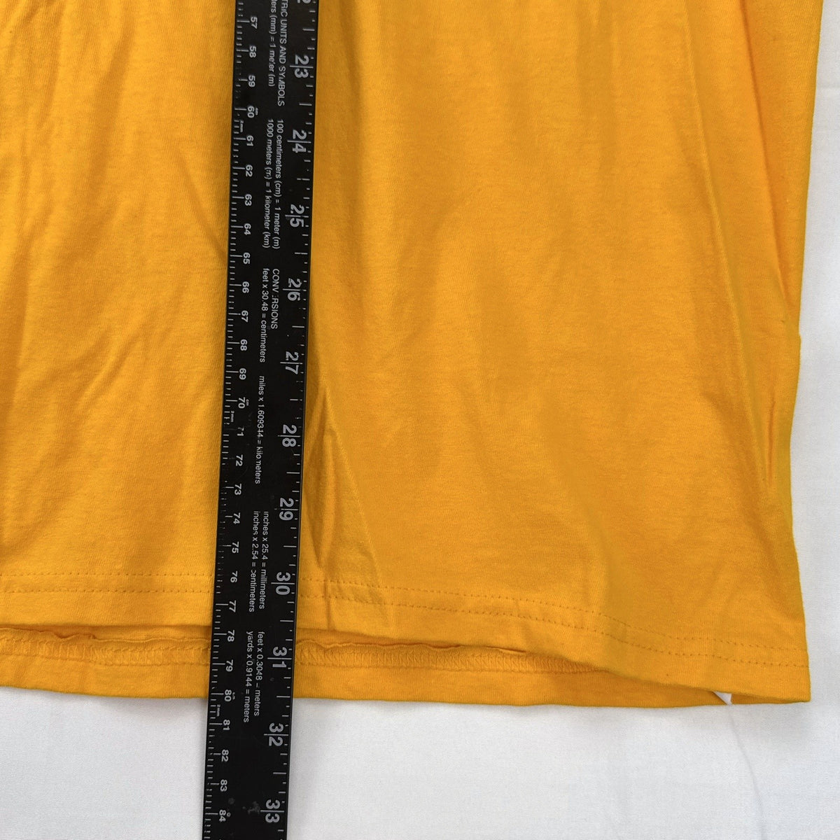 Front view of yellow adidas The Go-To graphic t-shirt in men's XL with black Badge of Sport logo