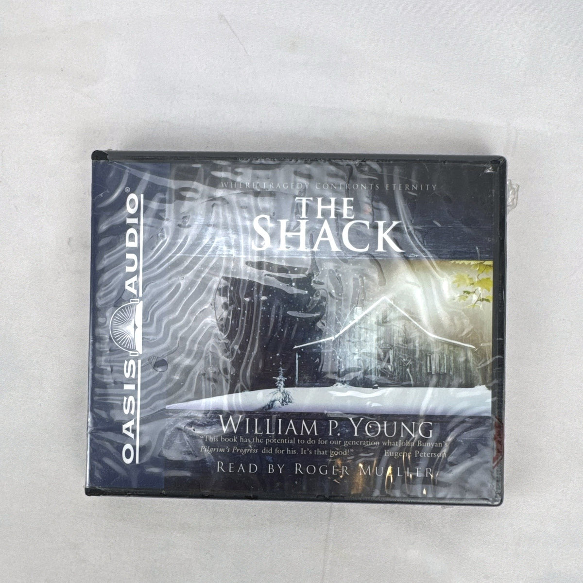 Factory-sealed Oasis Audio unabridged CD edition of The Shack by William P. Young in tall clamshell packaging.
