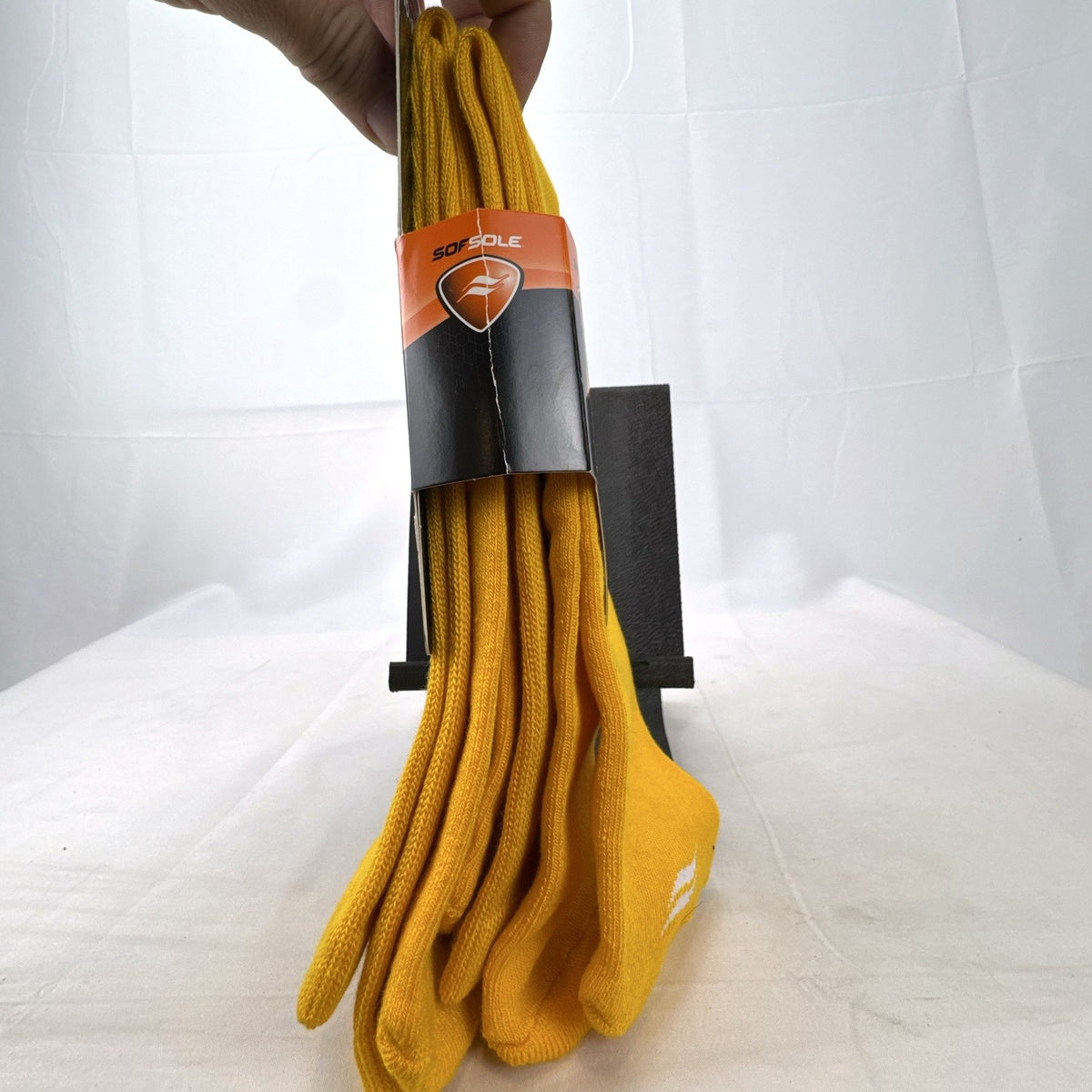 Bright yellow Sof Sole All Sport performance knee-high socks in original 2-pack retail packaging.