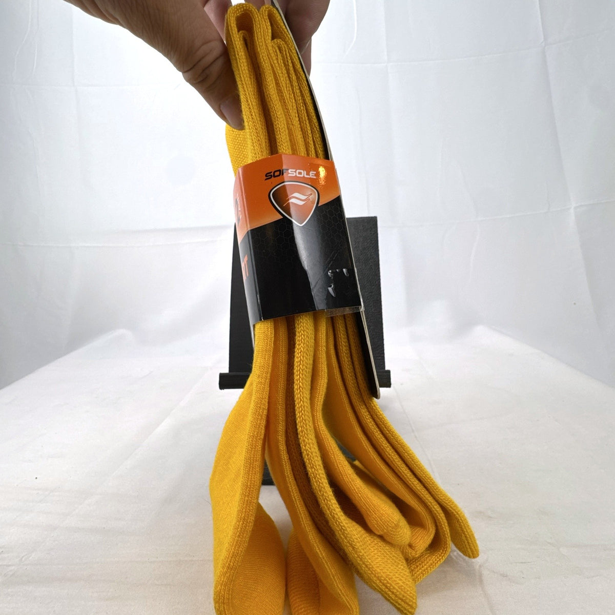 Bright yellow Sof Sole All Sport performance knee-high socks in original 2-pack retail packaging.