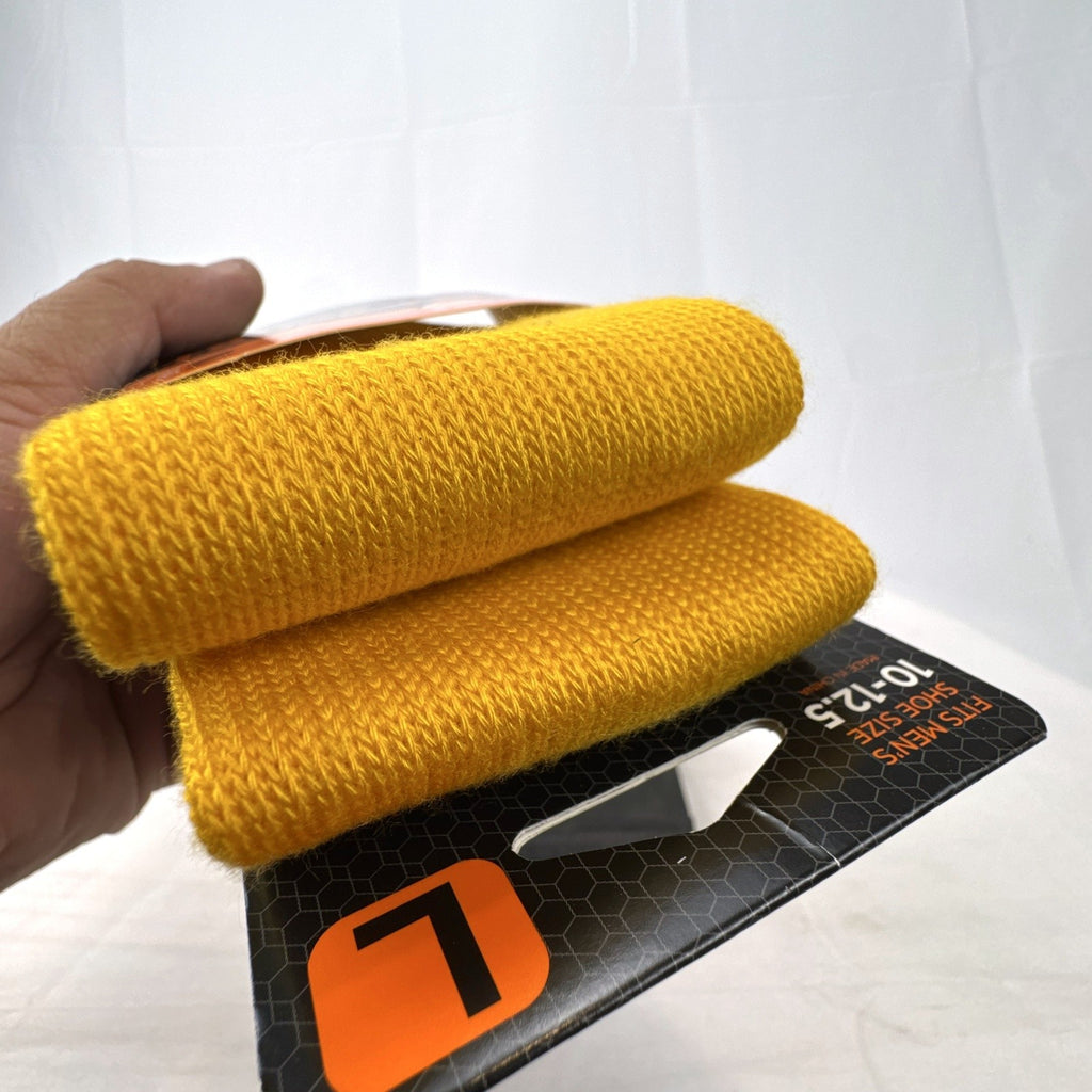 Bright yellow Sof Sole All Sport performance knee-high socks in original 2-pack retail packaging.