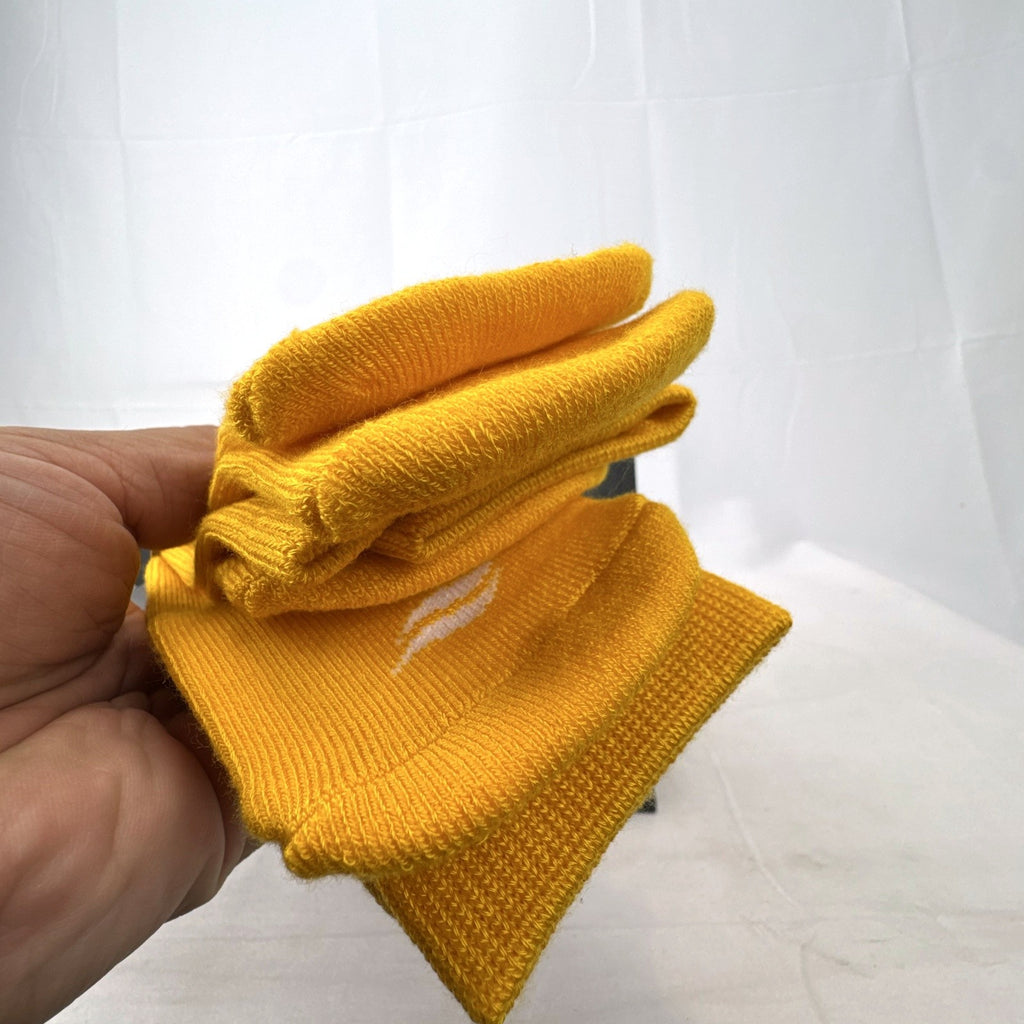 Bright yellow Sof Sole All Sport performance knee-high socks in original 2-pack retail packaging.
