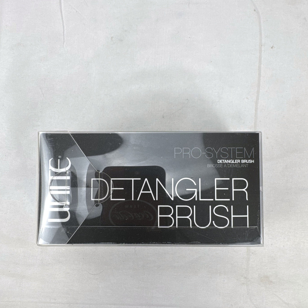 UNITE Pro-System black ergonomic palm detangler hairbrush in original clear box