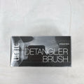UNITE Pro-System black ergonomic palm detangler hairbrush in original clear box