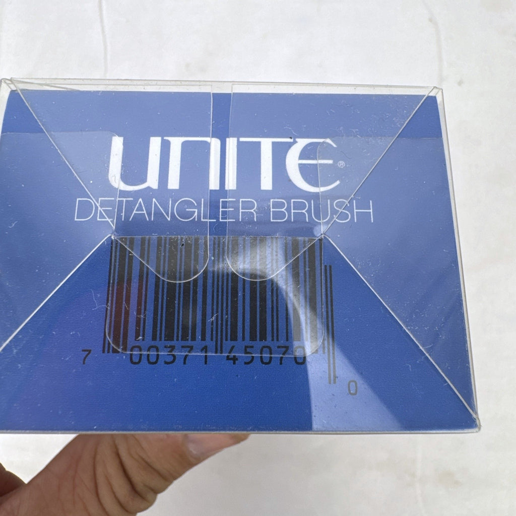 UNITE Pro-System black ergonomic palm detangler hairbrush in original clear box
