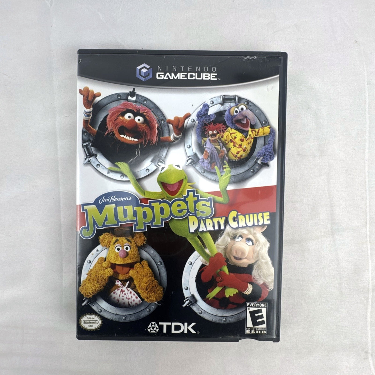 Jim Henson's Muppets Party Cruise game disc and case for Nintendo GameCube.