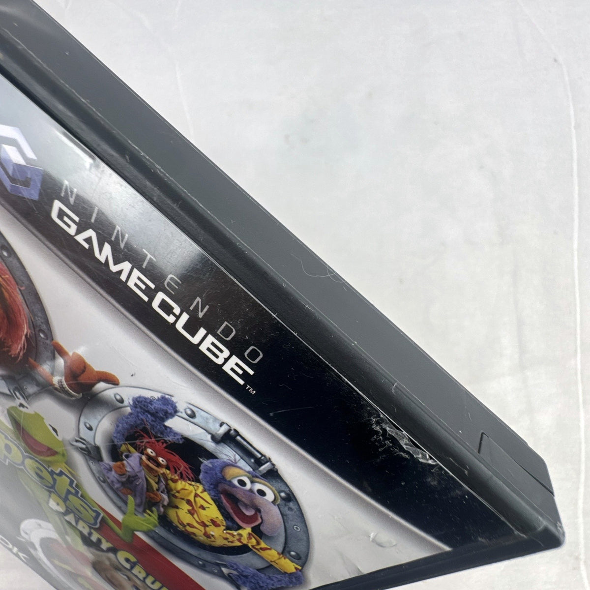 Jim Henson's Muppets Party Cruise game disc and case for Nintendo GameCube.
