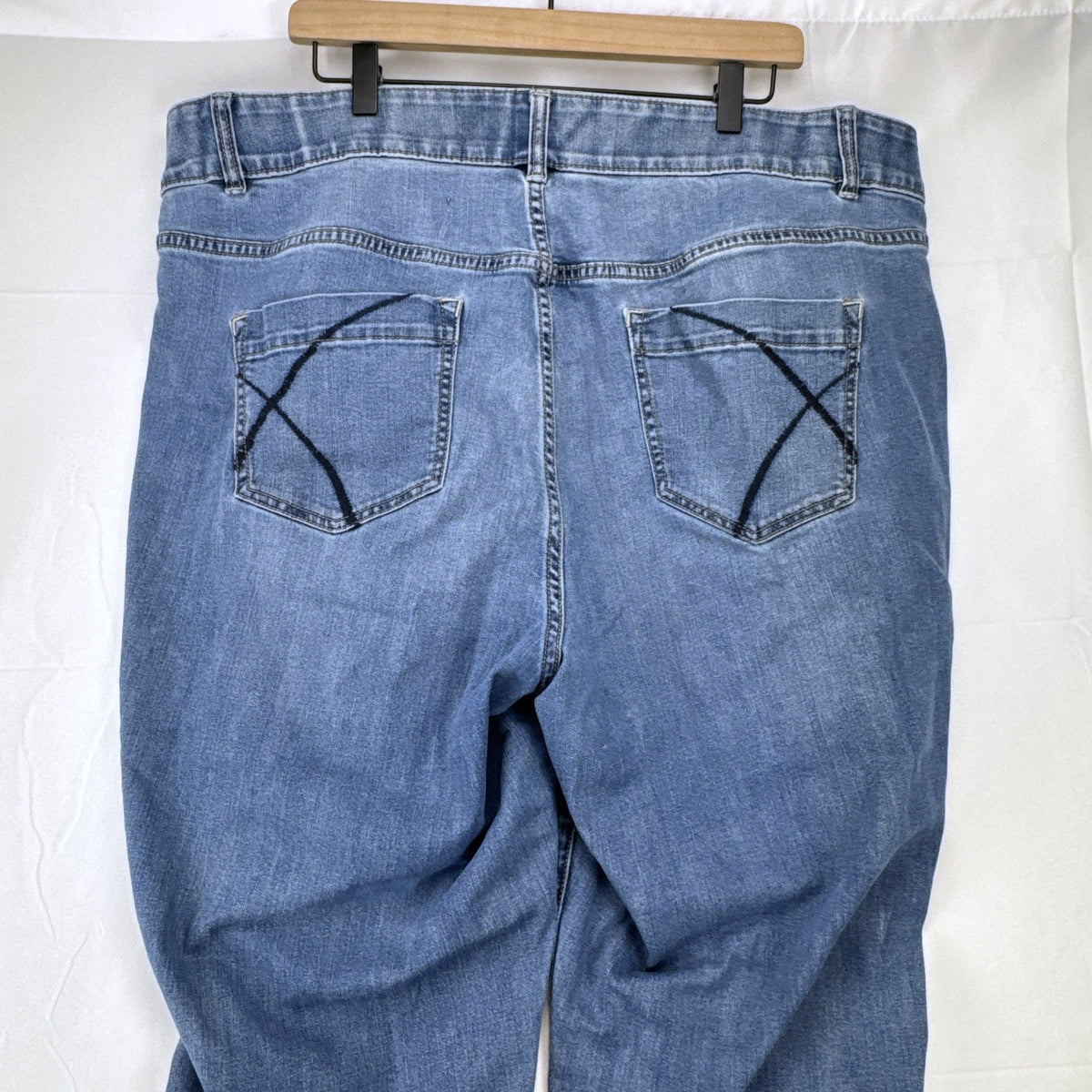 Lane Bryant women's plus size 22 medium wash stretch skinny ankle jeans with embroidered back pockets.