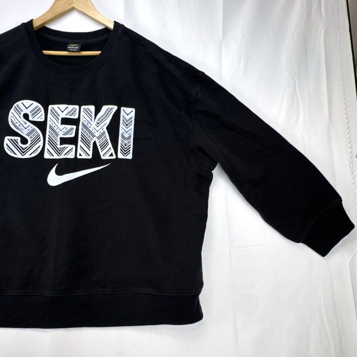 Women's plus size 3X Athletic Works black crewneck fleece sweatshirt with SEKI graphic print.