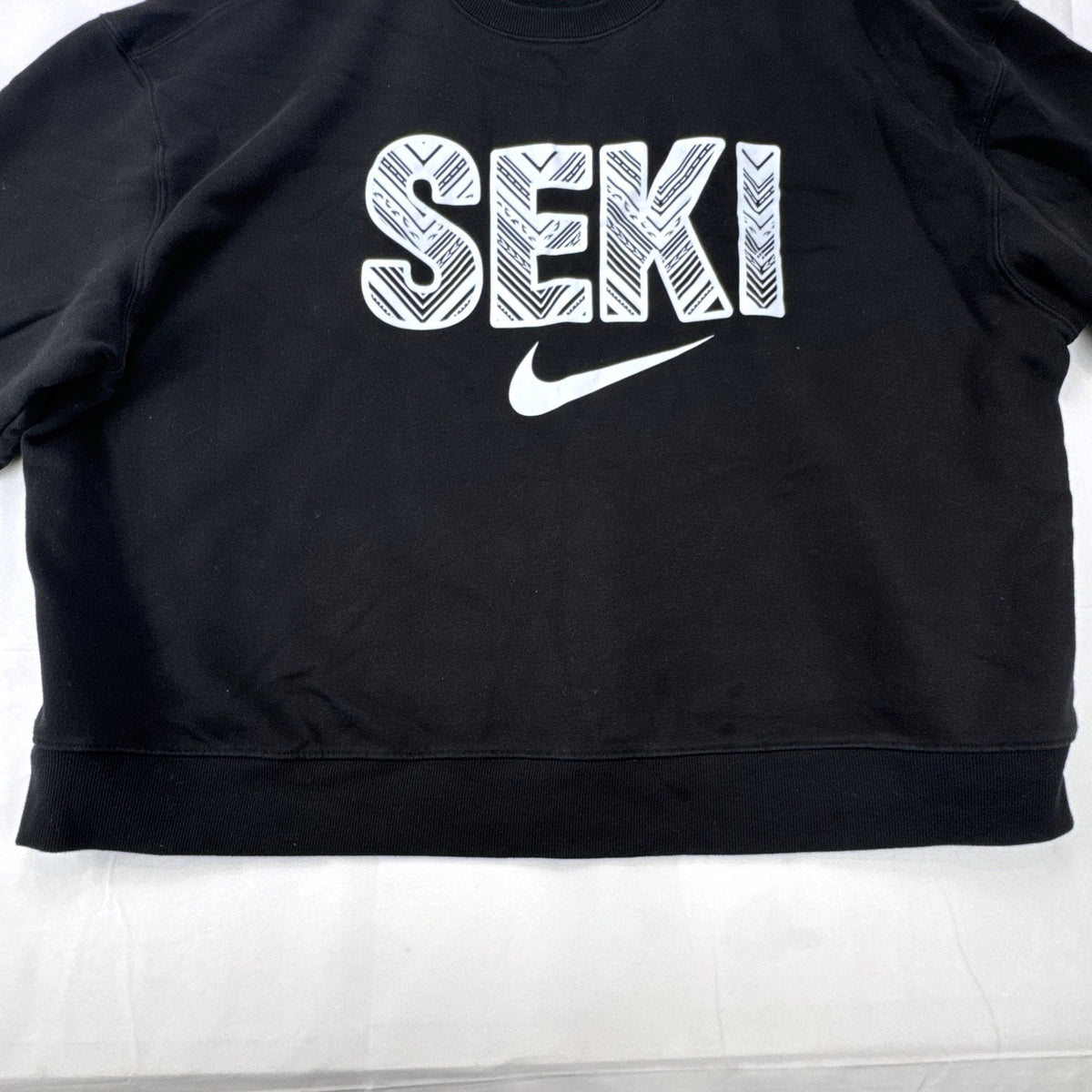 Women's plus size 3X Athletic Works black crewneck fleece sweatshirt with SEKI graphic print.