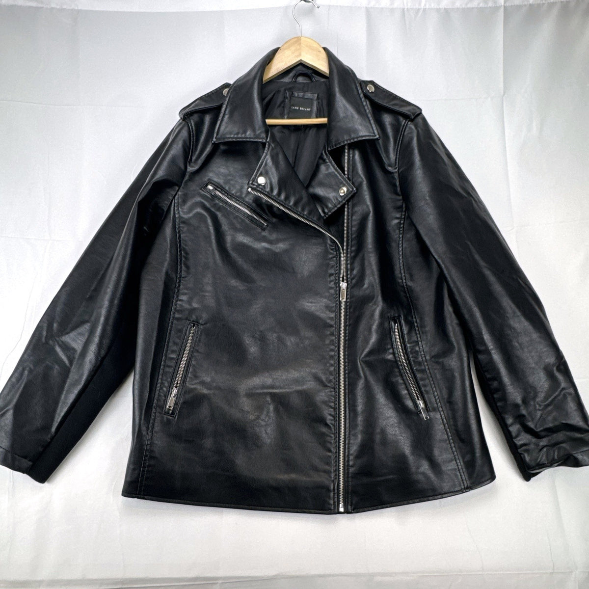 Lane Bryant women's plus size 22/24 black faux leather moto jacket with stretch knit sleeve panels.