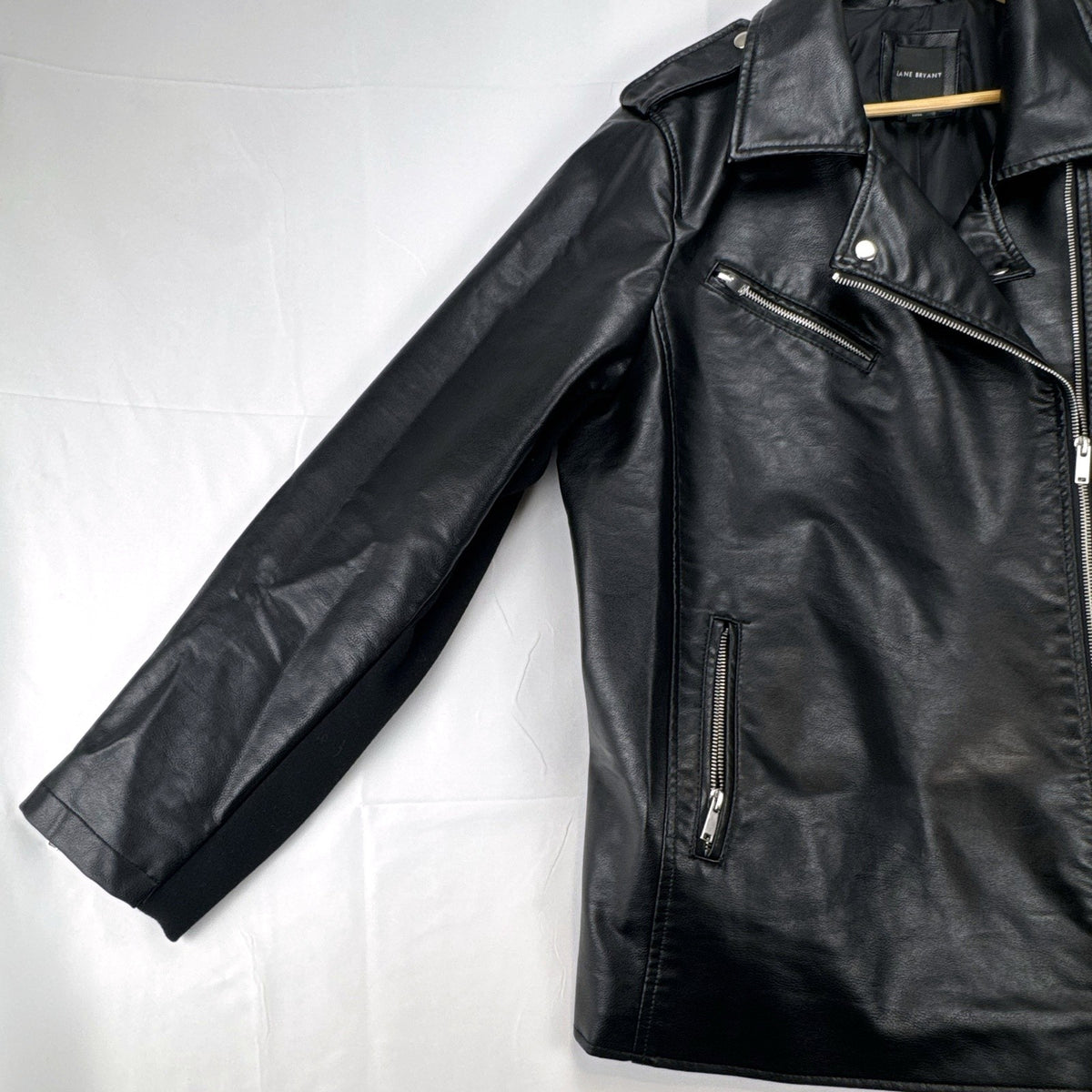 Lane Bryant women's plus size 22/24 black faux leather moto jacket with stretch knit sleeve panels.