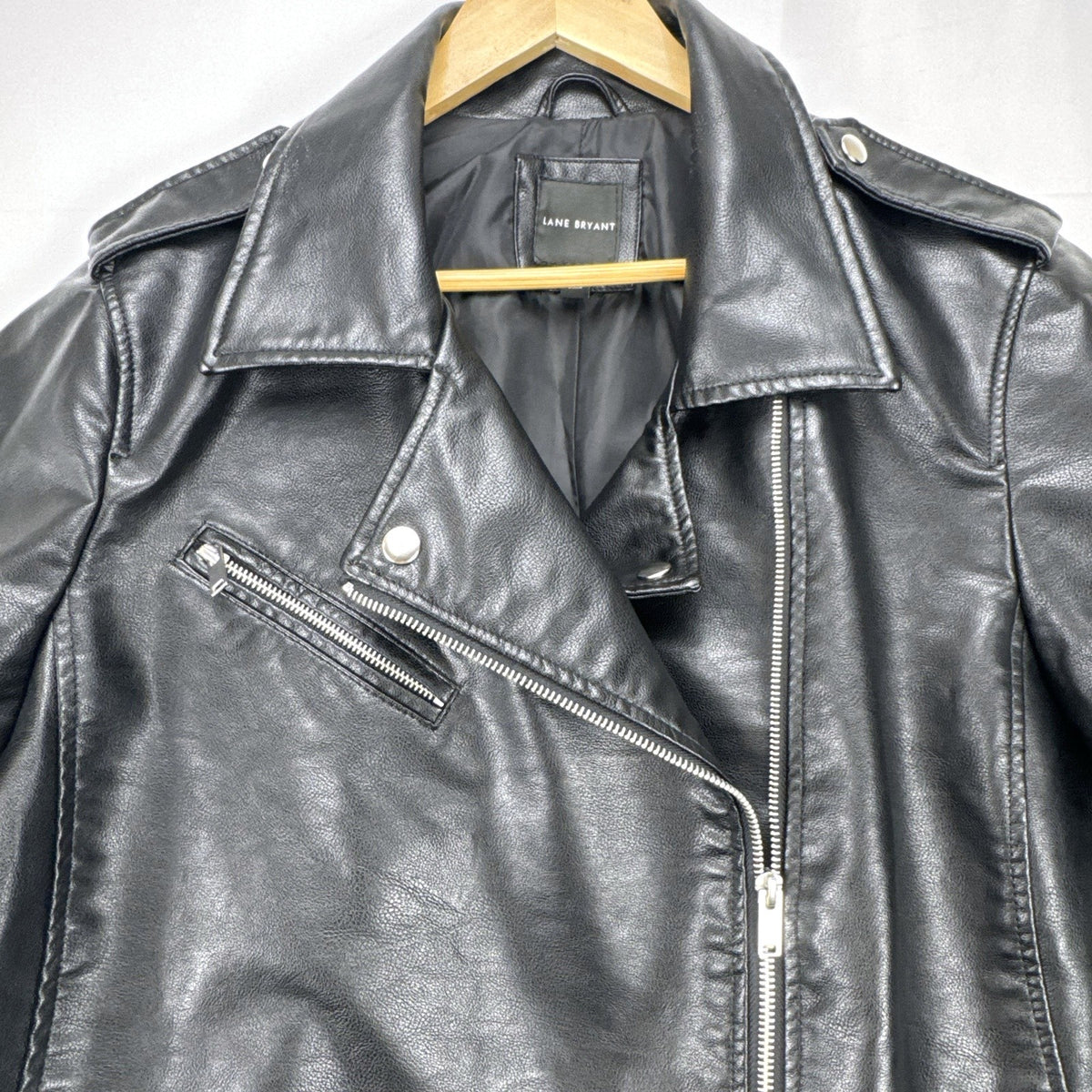 Lane Bryant women's plus size 22/24 black faux leather moto jacket with stretch knit sleeve panels.