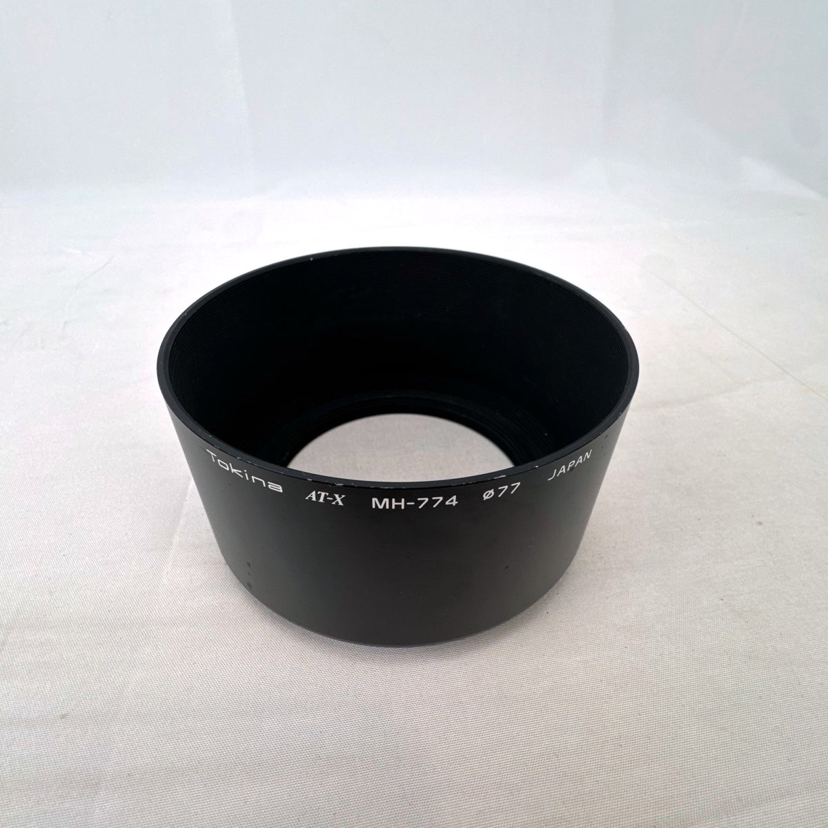 Tokina MH-774 AT-X 77mm round black metal screw-in lens hood made in Japan