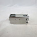 Vintage silver Minolta 16 II subminiature 16mm film camera showing Rokkor 22mm f/2.8 lens and metal push-pull body.