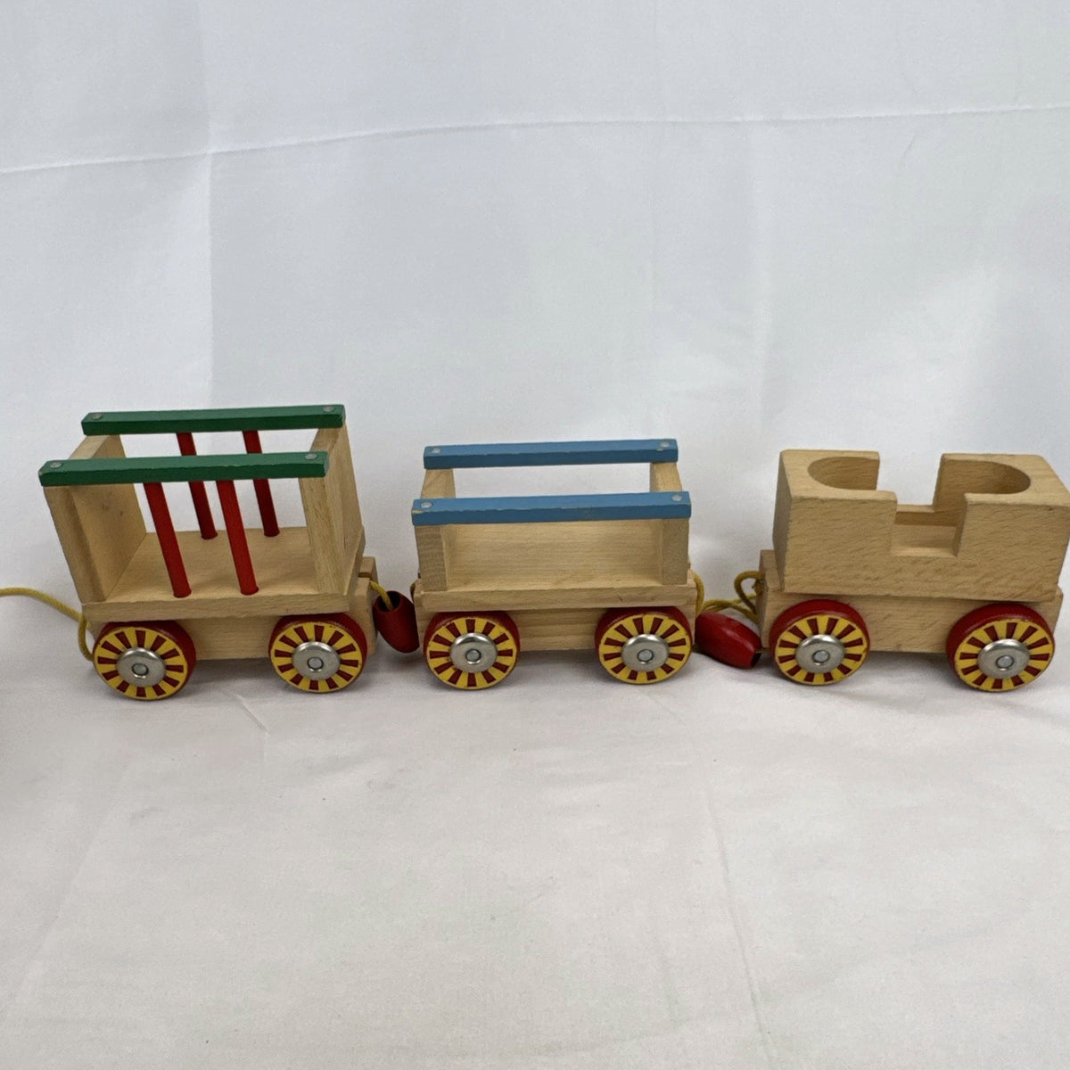 Vintage BRIO Swedish wooden pull toy train with locomotive and three connected wagons