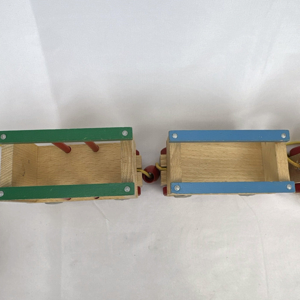 Vintage BRIO Swedish wooden pull toy train with locomotive and three connected wagons