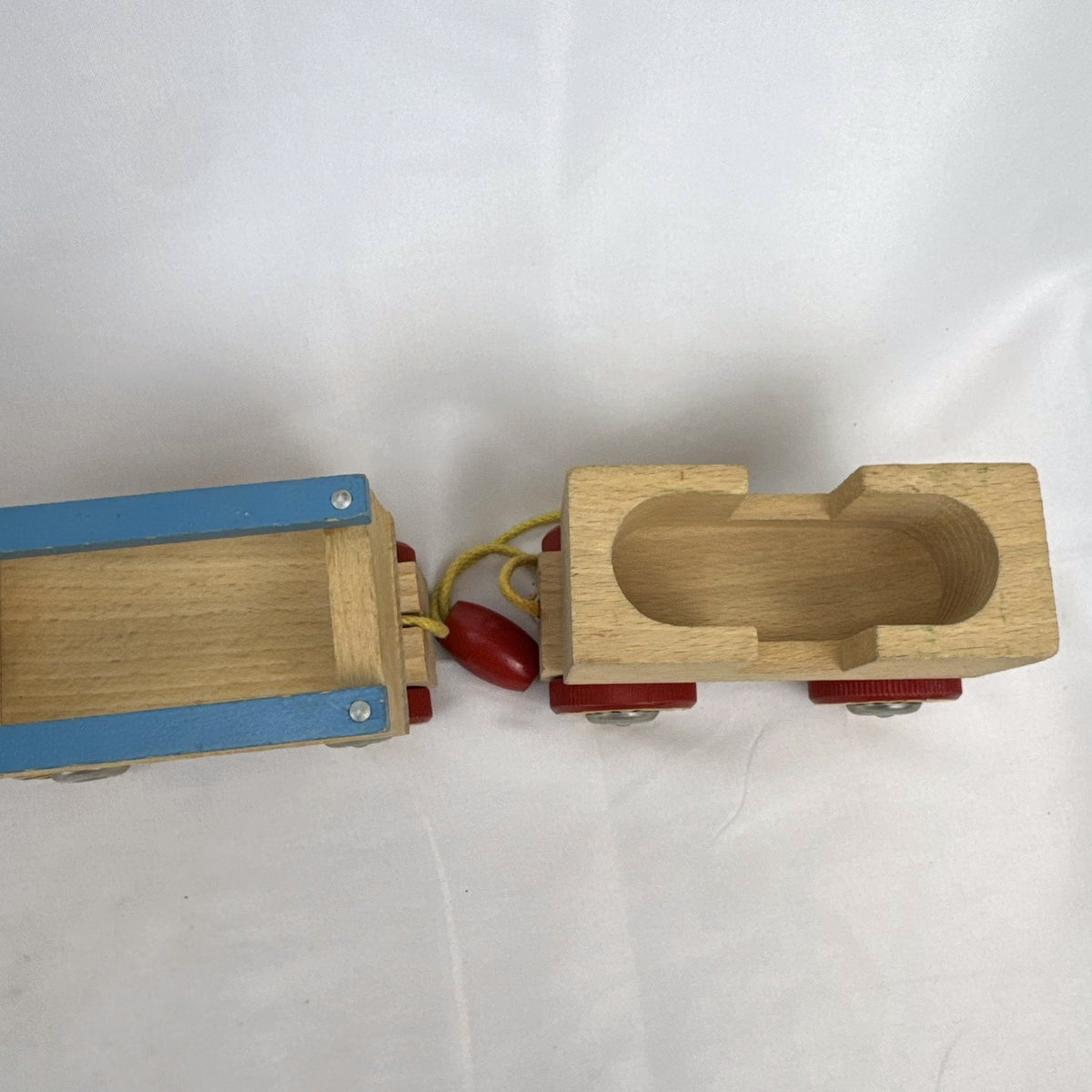 Vintage BRIO Swedish wooden pull toy train with locomotive and three connected wagons