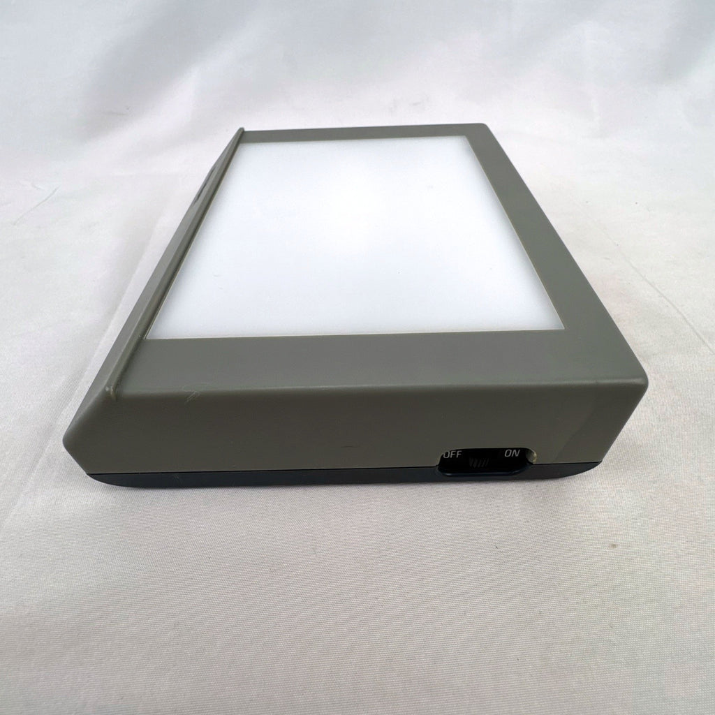 Letraset RotoVision portable gray desktop light box and slide viewer with fold-out stand