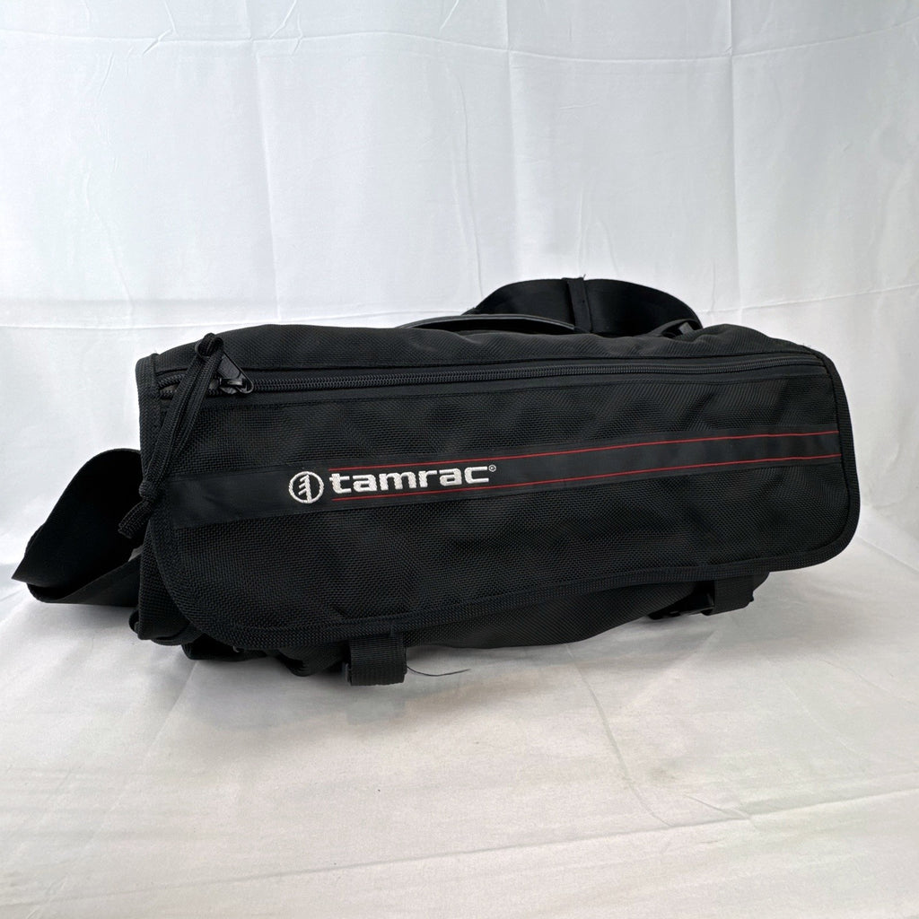 Tamrac black ballistic nylon padded camera shoulder bag with red accent stripe