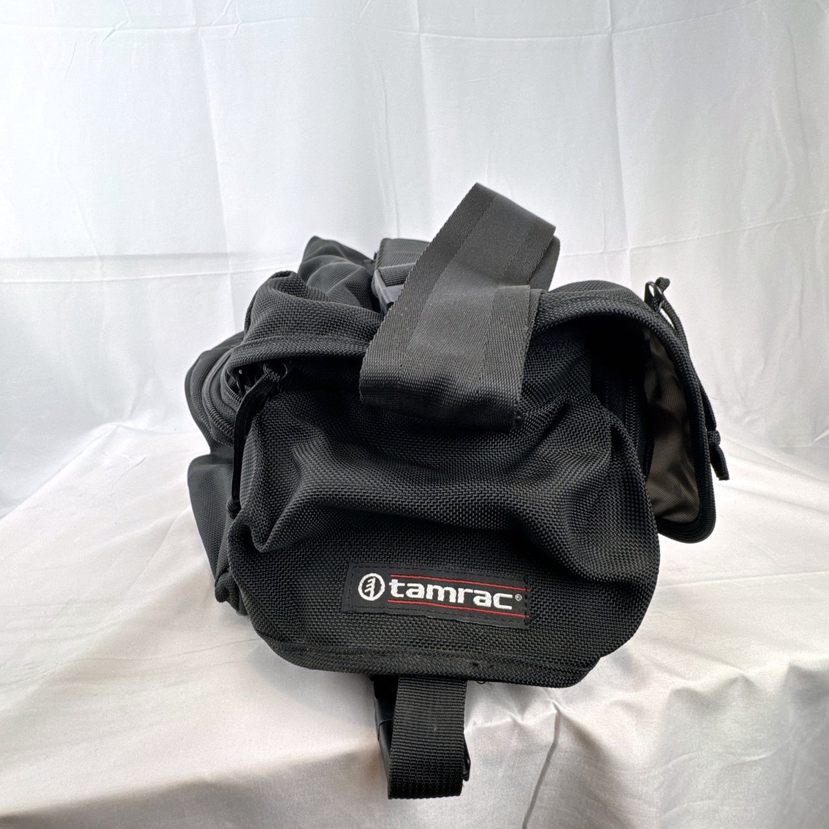 Tamrac black ballistic nylon padded camera shoulder bag with red accent stripe