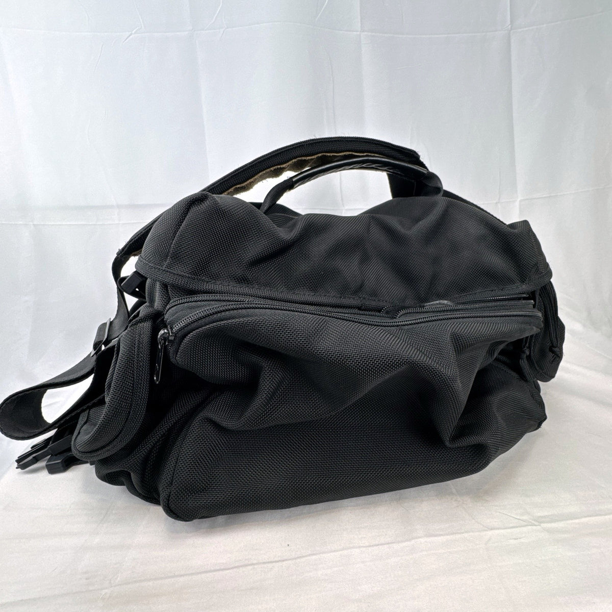 Tamrac black ballistic nylon padded camera shoulder bag with red accent stripe