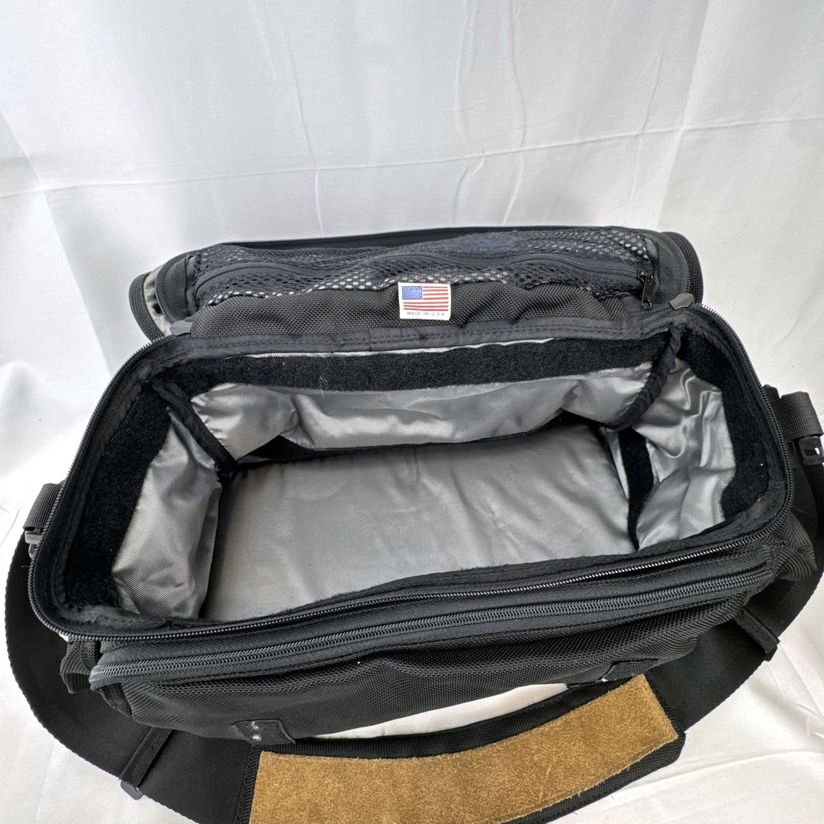 Tamrac black ballistic nylon padded camera shoulder bag with red accent stripe