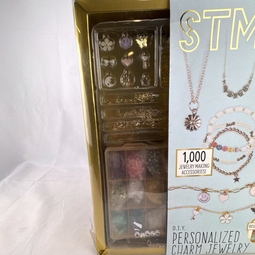 STMT D.I.Y. personalized charm jewelry making kit by Horizon Group USA with 1,000 pieces in factory sealed gold box