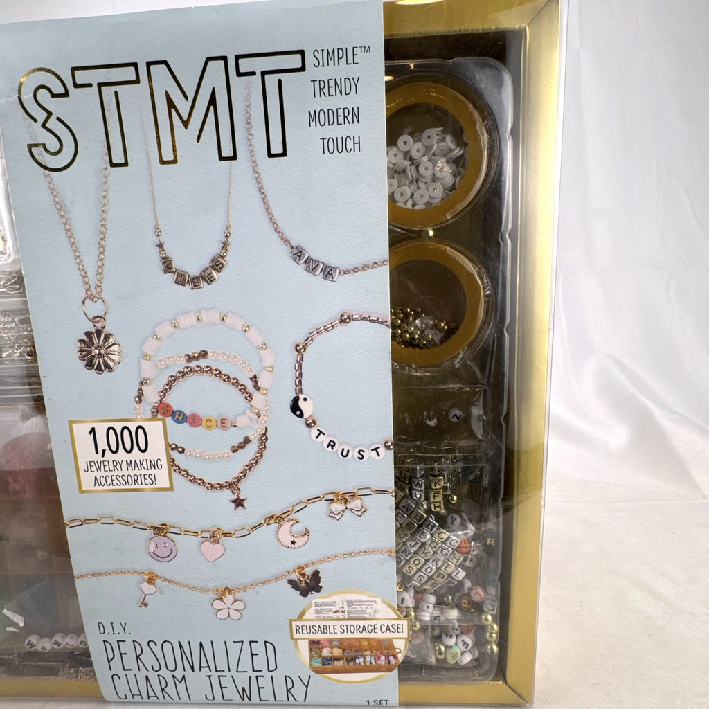 STMT D.I.Y. personalized charm jewelry making kit by Horizon Group USA with 1,000 pieces in factory sealed gold box