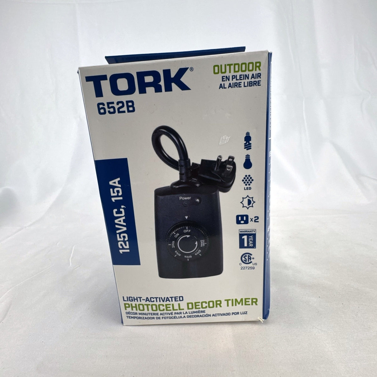 TORK 652B black outdoor photocell light timer with dual grounded outlets in its original packaging.