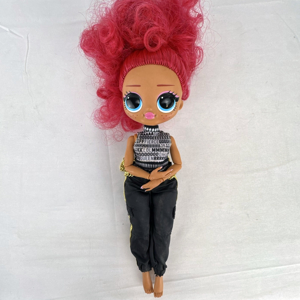 MGA L.O.L. Surprise OMG Neonlicious 10-inch doll with pink hair in black and gold track pants outfit