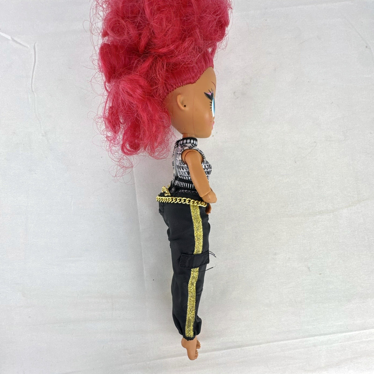 MGA L.O.L. Surprise OMG Neonlicious 10-inch doll with pink hair in black and gold track pants outfit