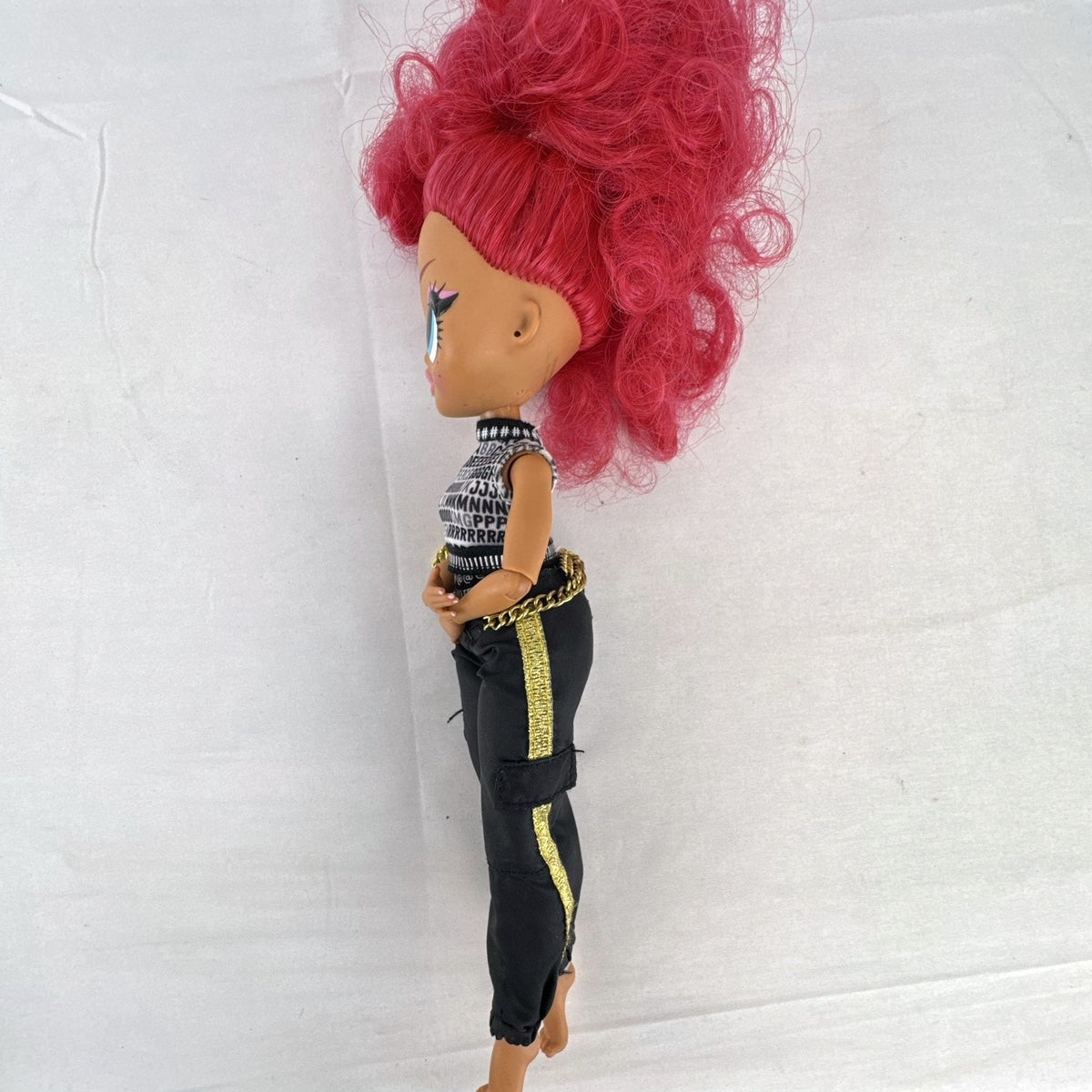 MGA L.O.L. Surprise OMG Neonlicious 10-inch doll with pink hair in black and gold track pants outfit