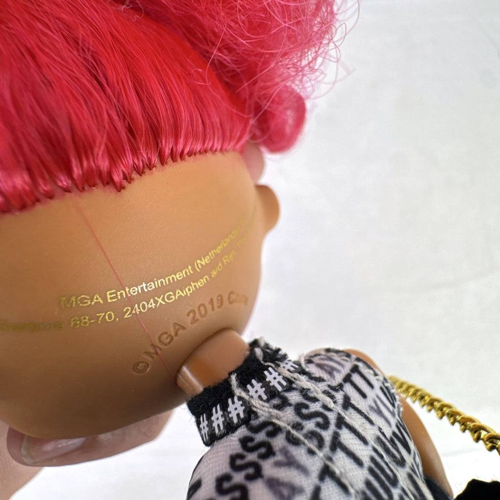 MGA L.O.L. Surprise OMG Neonlicious 10-inch doll with pink hair in black and gold track pants outfit
