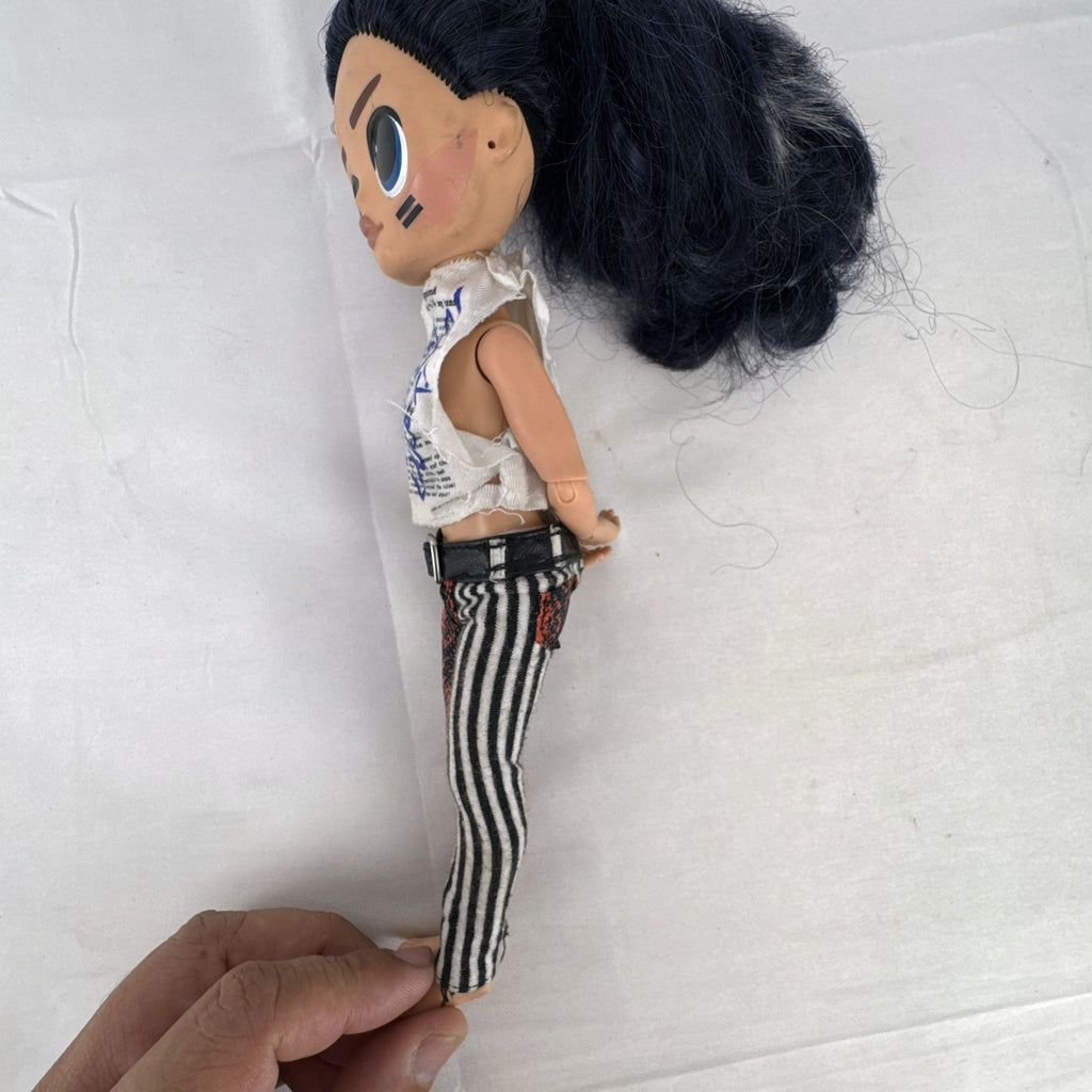 MGA L.O.L. Surprise! O.M.G. Remix Rocker Boi 10-inch articulated male fashion doll in graphic outfit