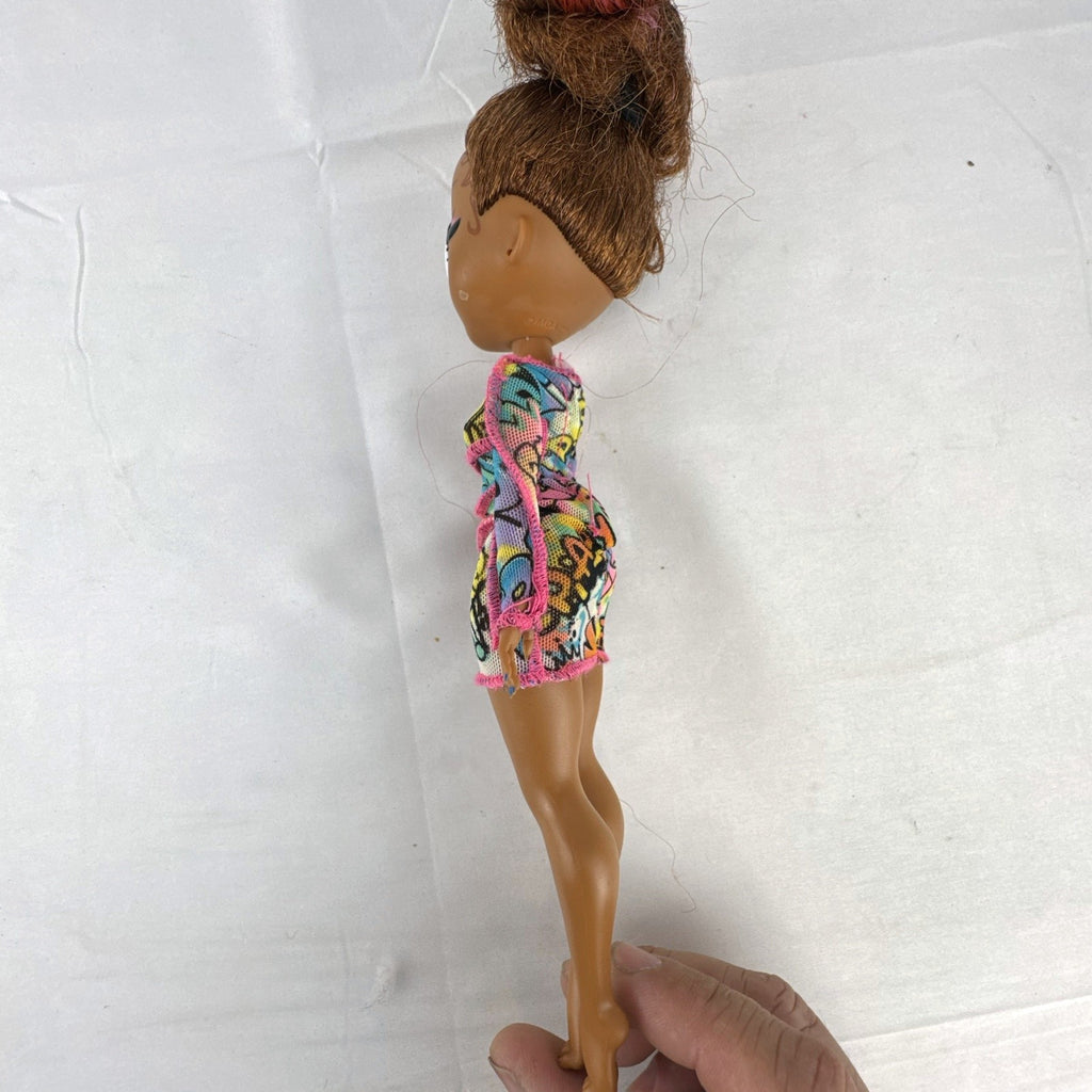 MGA L.O.L. Surprise! O.M.G. 10-inch 24K D.J. Winter Disco fashion doll wearing her graffiti-print dress