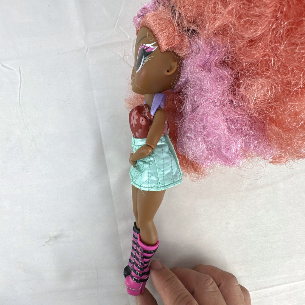 MGA L.O.L. Surprise! O.M.G. Queens Miss Divine 10-inch doll with pink curls, floral top, and metallic skirt