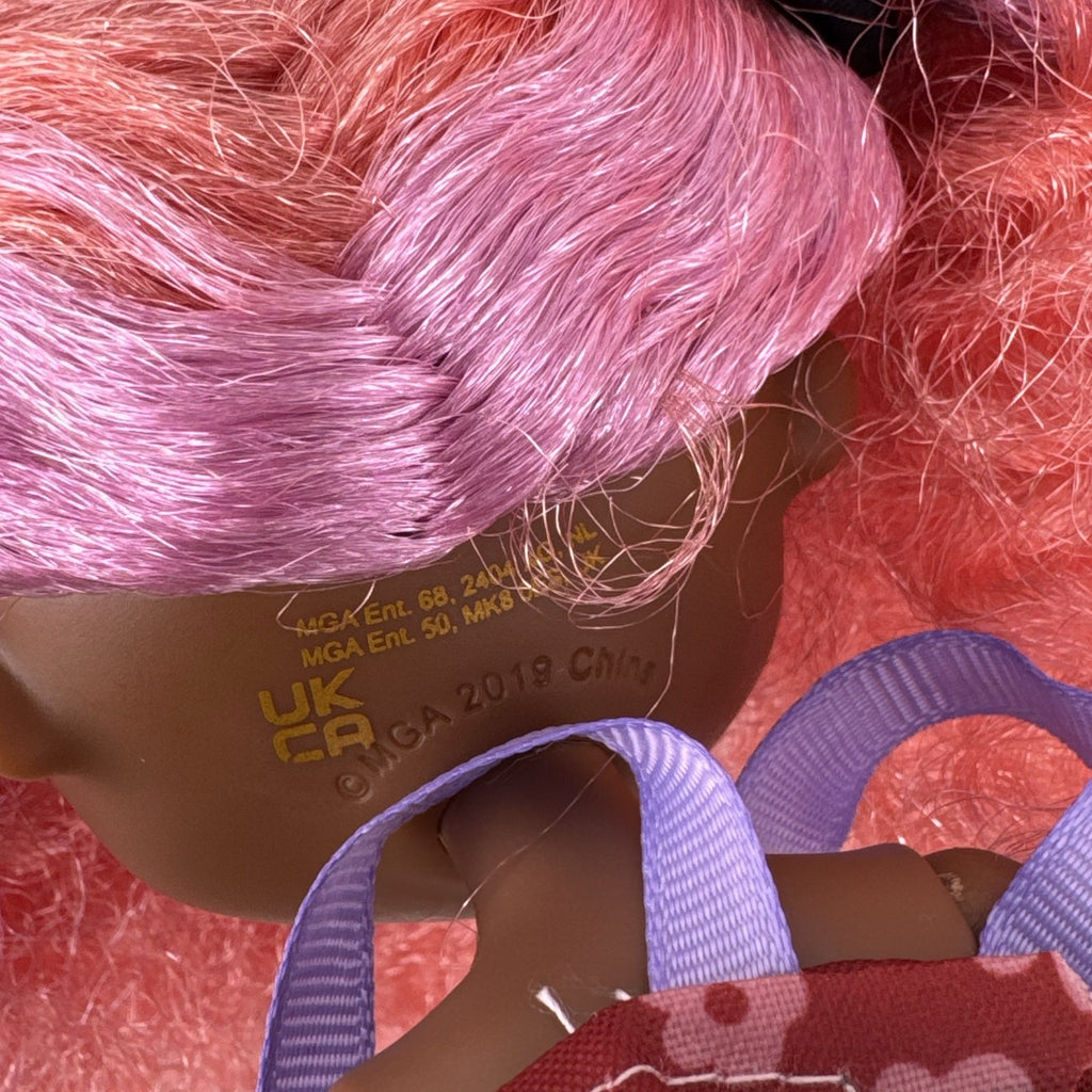 MGA L.O.L. Surprise! O.M.G. Queens Miss Divine 10-inch doll with pink curls, floral top, and metallic skirt
