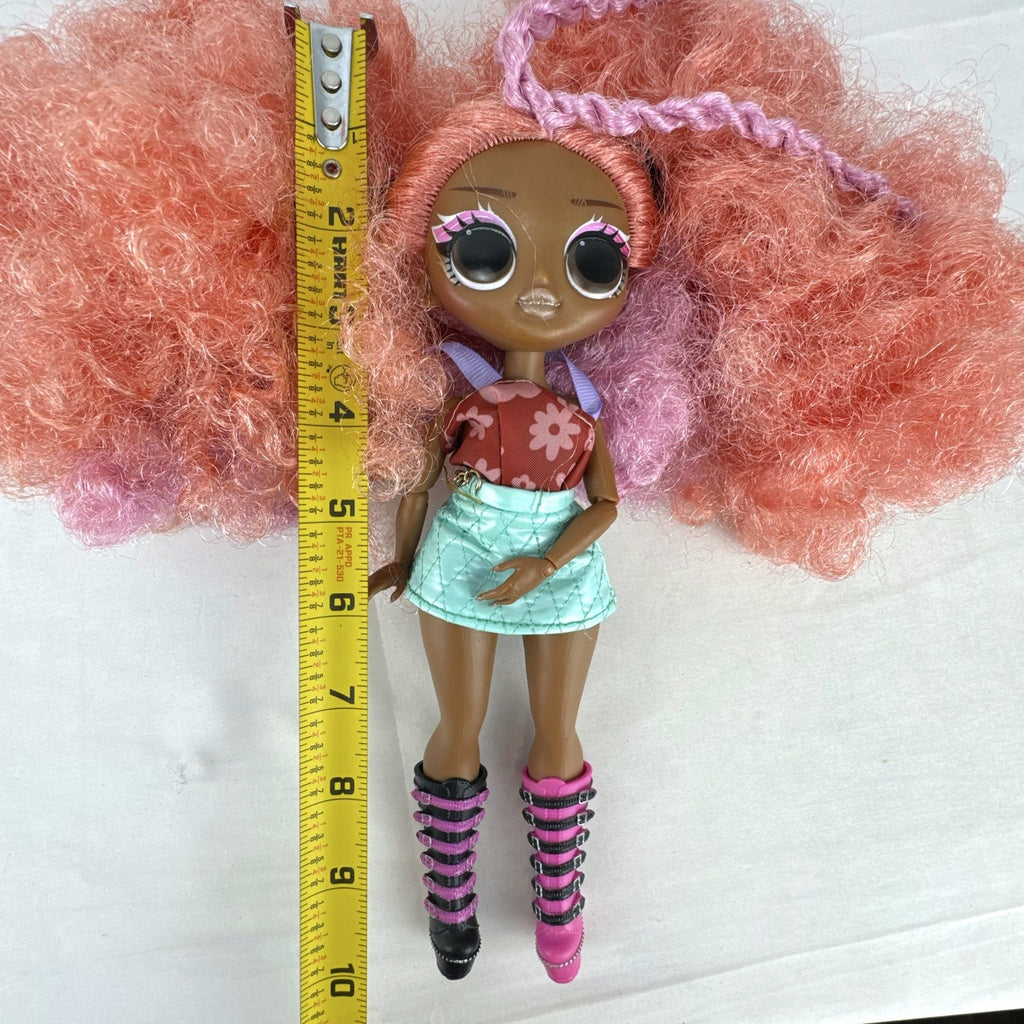 MGA L.O.L. Surprise! O.M.G. Queens Miss Divine 10-inch doll with pink curls, floral top, and metallic skirt