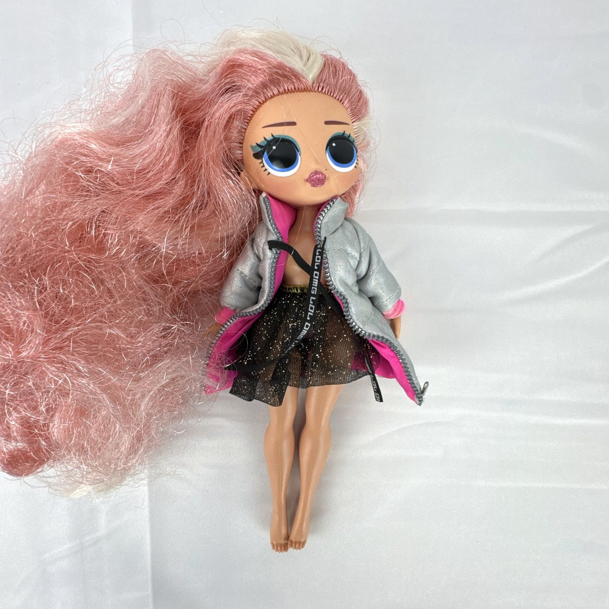 MGA L.O.L. Surprise O.M.G. Cosmic Nova doll in silver puffer jacket with pink crimped hair