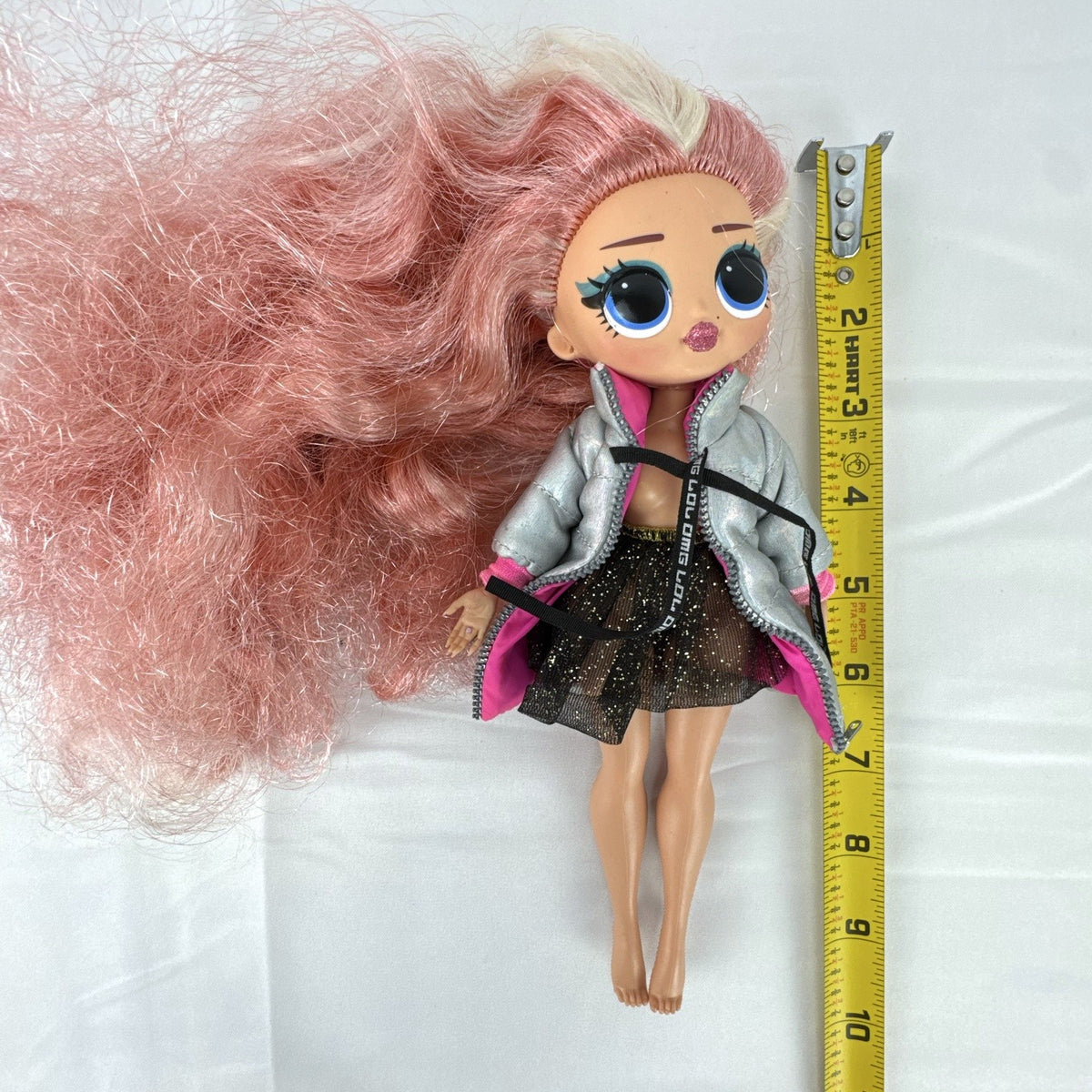 MGA L.O.L. Surprise O.M.G. Cosmic Nova doll in silver puffer jacket with pink crimped hair