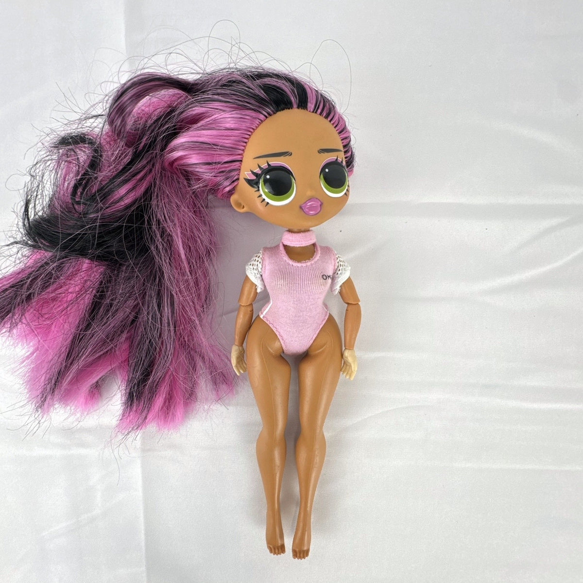 MGA L.O.L. Surprise! OMG Sports Vault Queen 10-inch doll with pink and black hair in pink gymnastics leotard