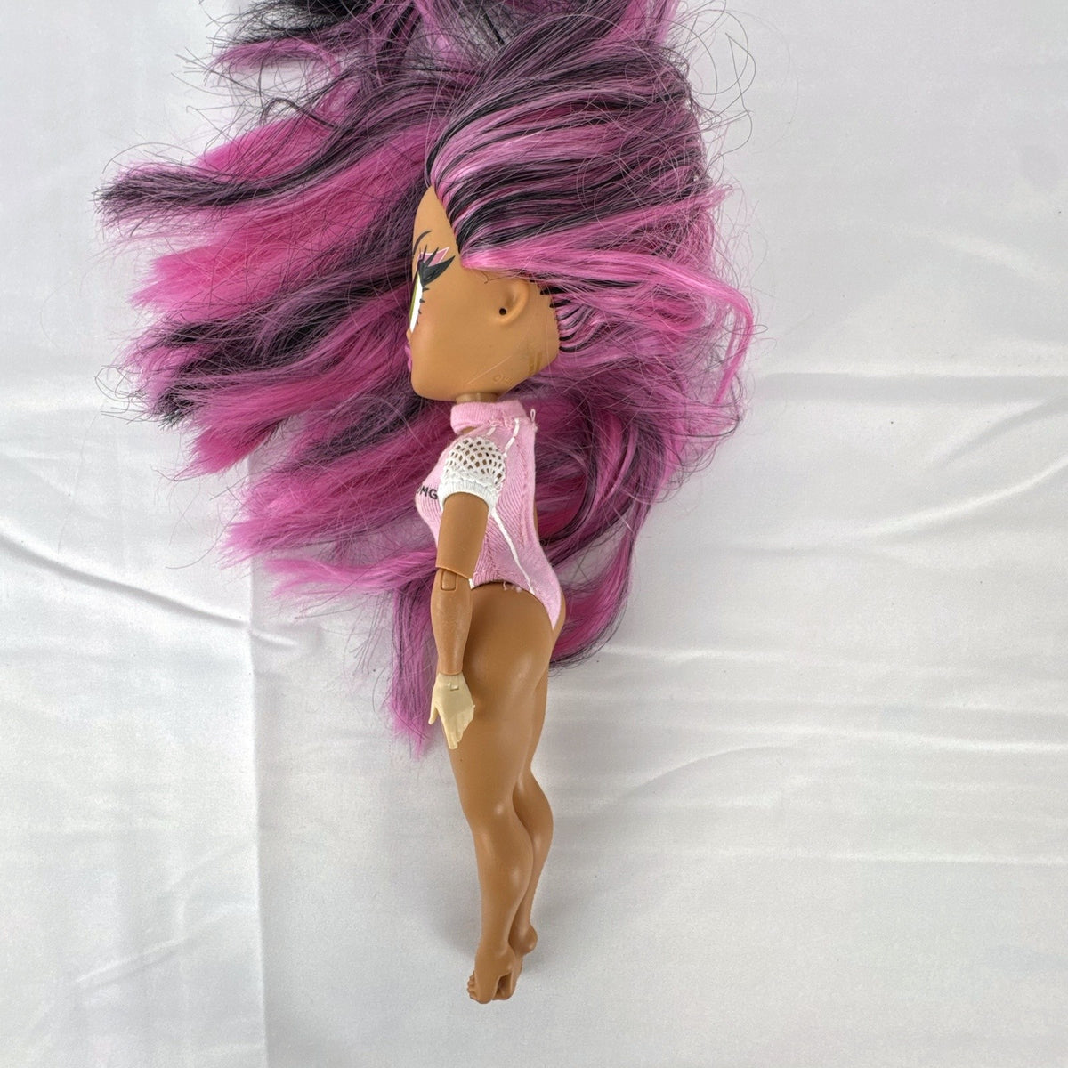 MGA L.O.L. Surprise! OMG Sports Vault Queen 10-inch doll with pink and black hair in pink gymnastics leotard