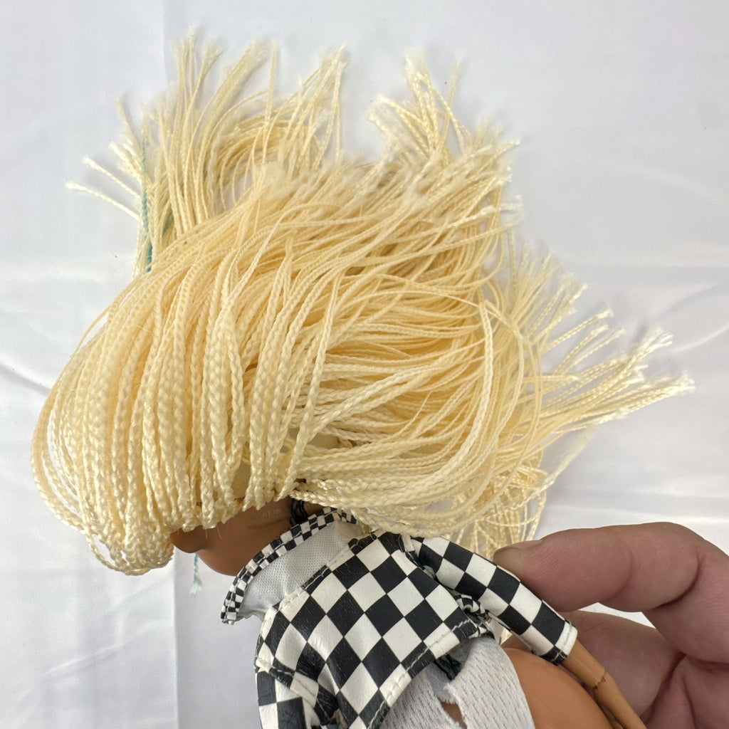 MGA L.O.L. Surprise! O.M.G. Speedster doll in checkerboard racing jacket with blonde micro braids