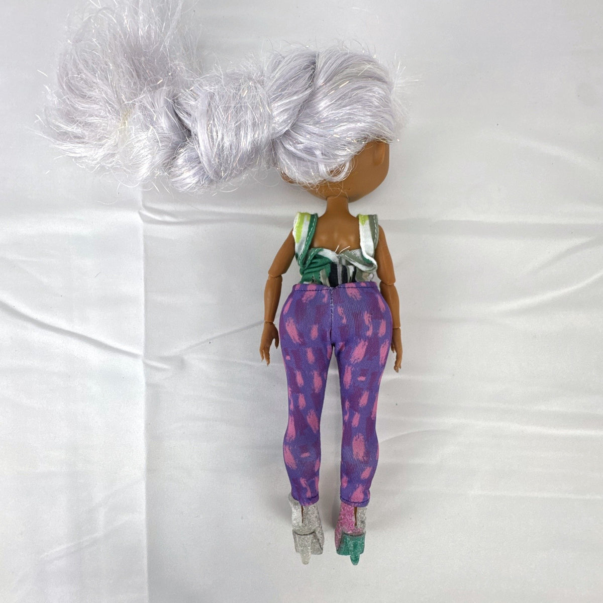 L.O.L. Surprise! O.M.G. Cosmic Nova 10-inch Winter Disco fashion doll with silver tinsel braid and glitter boots