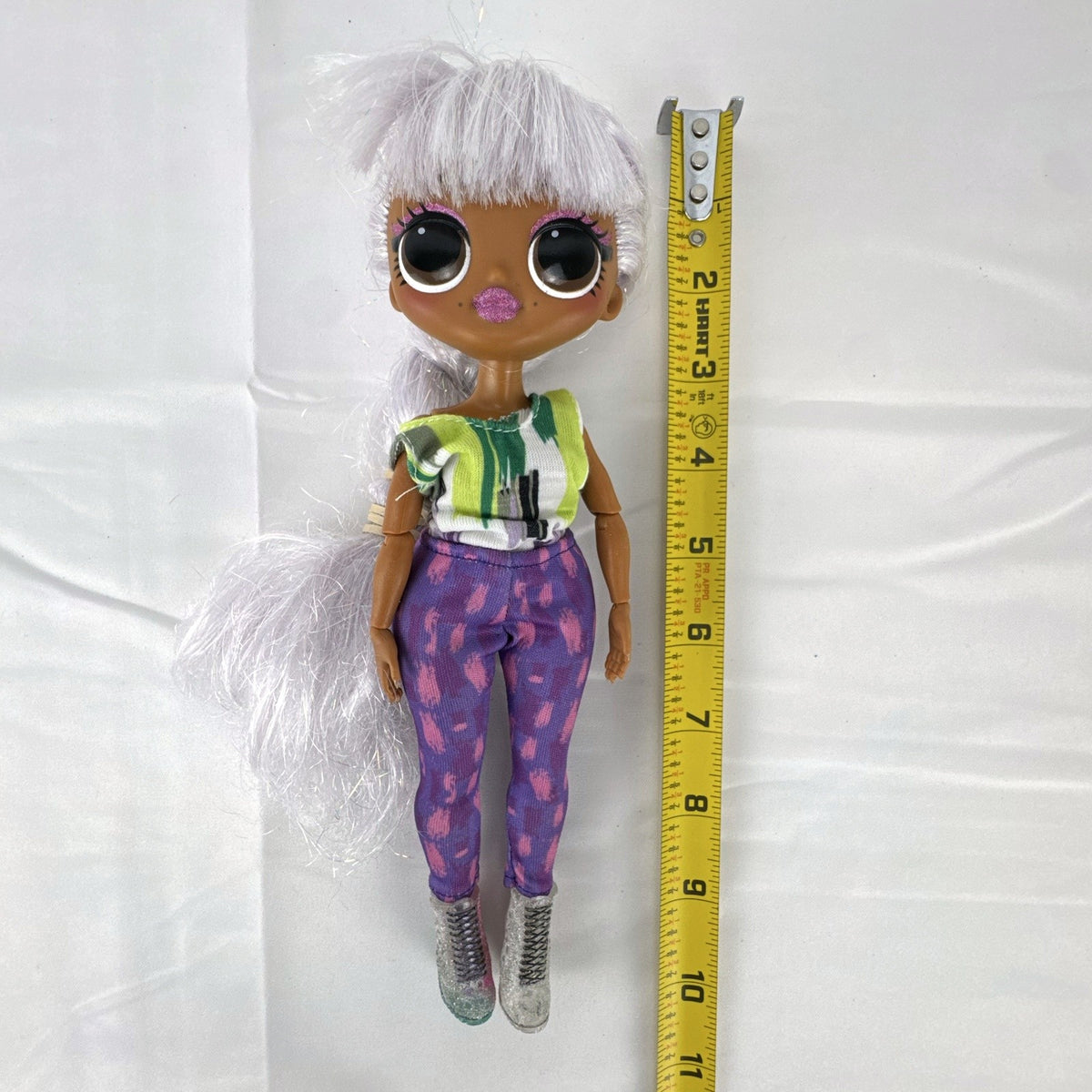 L.O.L. Surprise! O.M.G. Cosmic Nova 10-inch Winter Disco fashion doll with silver tinsel braid and glitter boots
