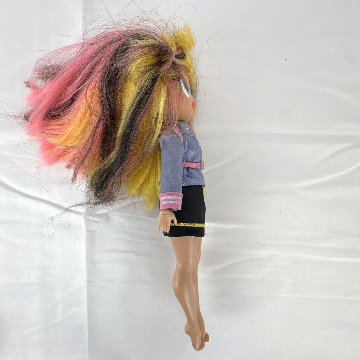 MGA L.O.L. Surprise! O.M.G. Neonlicious 10-inch doll in gray cropped jacket and black shorts.